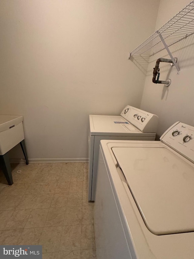 6 Sickler Ct, Sewell, NJ 08080 - laundry room with washing machine and clothes dryer, light flooring, and baseboards