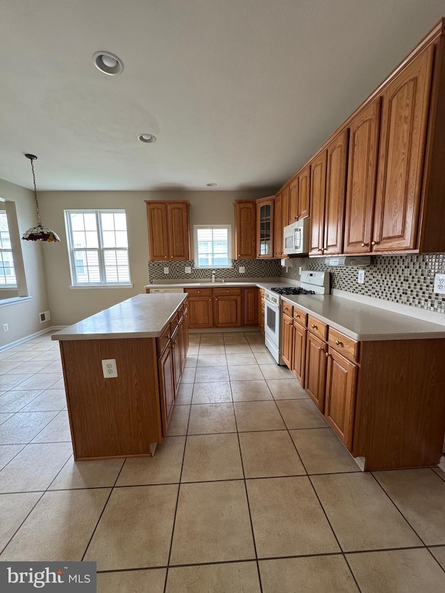 6 Sickler Ct, Sewell, NJ 08080 - kitchen featuring white appliances, brown cabinetry, backsplash, a sink, and recessed lighting