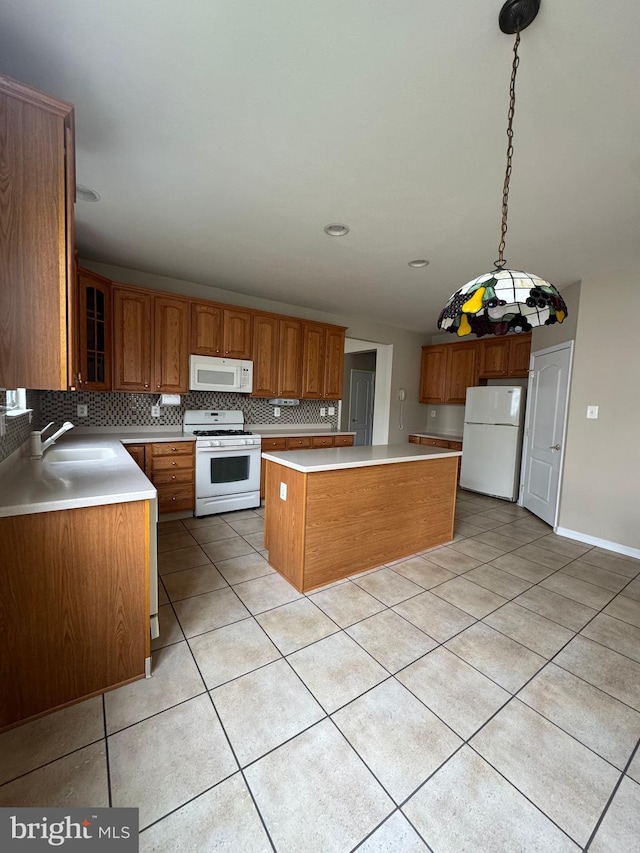 6 Sickler Ct, Sewell, NJ 08080 - kitchen featuring white appliances, a sink, light tile patterned flooring, brown cabinetry, and backsplash