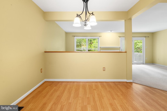 2932 Winters Chase Way, Annapolis, MD 21401 - empty room featuring a chandelier, wood finished floors, and baseboards