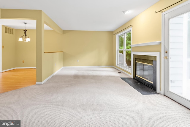 2932 Winters Chase Way, Annapolis, MD 21401 - unfurnished living room with carpet flooring, a chandelier, a fireplace with flush hearth, and baseboards
