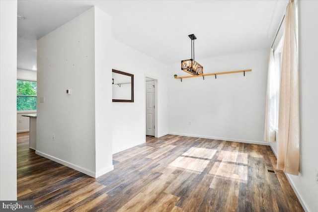 163 Hyde Park Ln, Charles Town, WV 25414 - unfurnished dining area with a chandelier, wood finished floors, and baseboards
