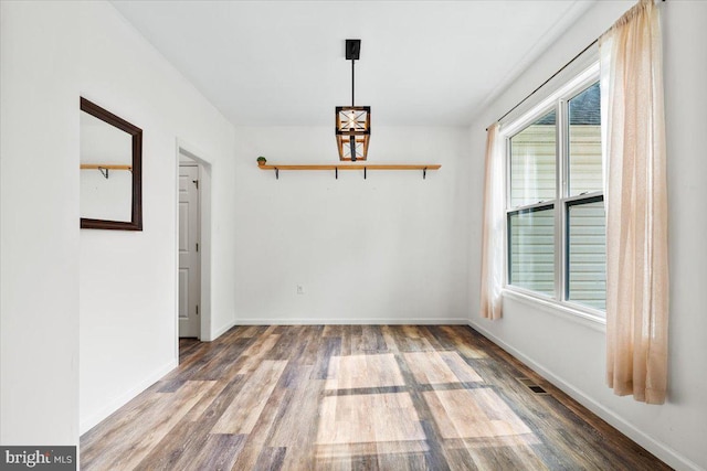 163 Hyde Park Ln, Charles Town, WV 25414 - unfurnished dining area with wood finished floors and baseboards
