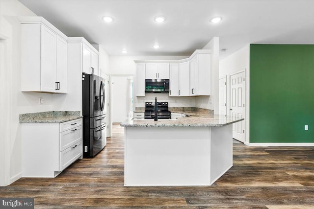 163 Hyde Park Ln, Charles Town, WV 25414 - kitchen featuring appliances with stainless steel finishes, white cabinetry, a peninsula, light stone counters, and dark wood-style flooring