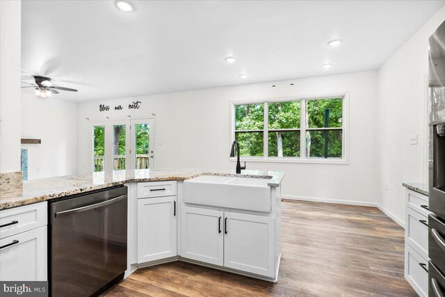 163 Hyde Park Ln, Charles Town, WV 25414 - kitchen featuring dishwasher, a sink, healthy amount of natural light, wood finished floors, and recessed lighting