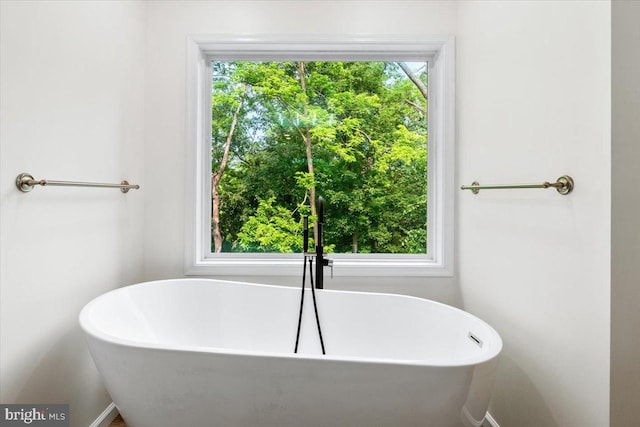 163 Hyde Park Ln, Charles Town, WV 25414 - full bathroom with a soaking tub and baseboards