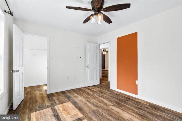 163 Hyde Park Ln, Charles Town, WV 25414 - unfurnished bedroom featuring wood finished floors, baseboards, a closet, a spacious closet, and ceiling fan