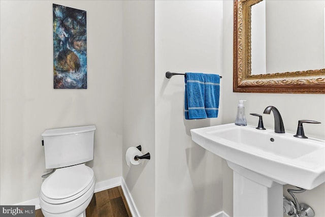 368 Star Tavern Ln, West Chester, PA 19382 - half bathroom featuring toilet, baseboards, and wood finished floors