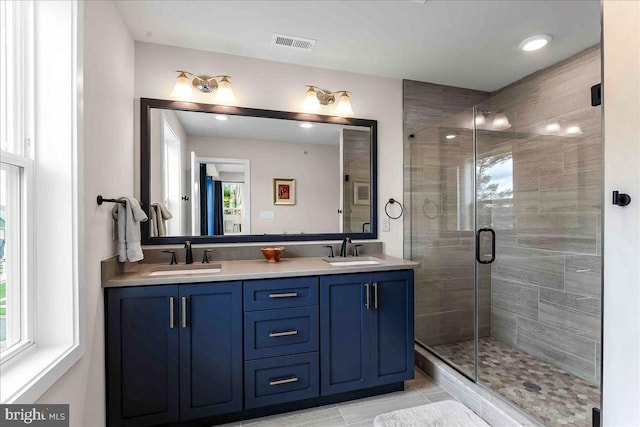 368 Star Tavern Ln, West Chester, PA 19382 - bathroom featuring double vanity, a shower stall, tile patterned flooring, and recessed lighting