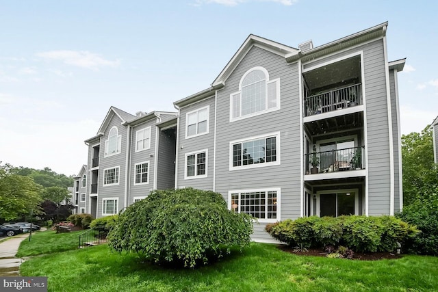 20408 Shore Harbour Dr Unit 5-H, Germantown, MD 20874 - rear view of house with a yard and a balcony