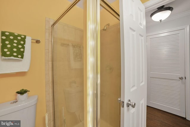 20408 Shore Harbour Dr Unit 5-H, Germantown, MD 20874 - bathroom with toilet, a stall shower, ornamental molding, and wood finished floors