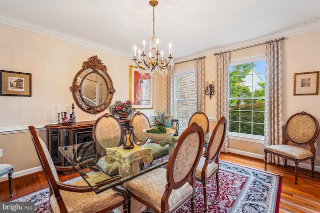 18403 Rim Rock Cir, Leesburg, VA 20176 - dining room featuring a chandelier, crown molding, baseboards, and wood finished floors