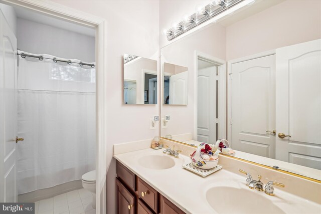 18403 Rim Rock Cir, Leesburg, VA 20176 - bathroom featuring double vanity, toilet, shower / bathtub combination with curtain, and tile patterned flooring