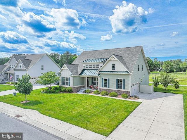 24440 Harvest Cir, Milton, DE 19968 - craftsman-style home featuring a standing seam roof, a garage, board and batten siding, and stone siding