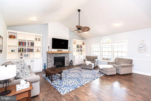 24440 Harvest Cir, Milton, DE 19968 - living area featuring vaulted ceiling, ceiling fan, dark wood finished floors, a stone fireplace, and baseboards
