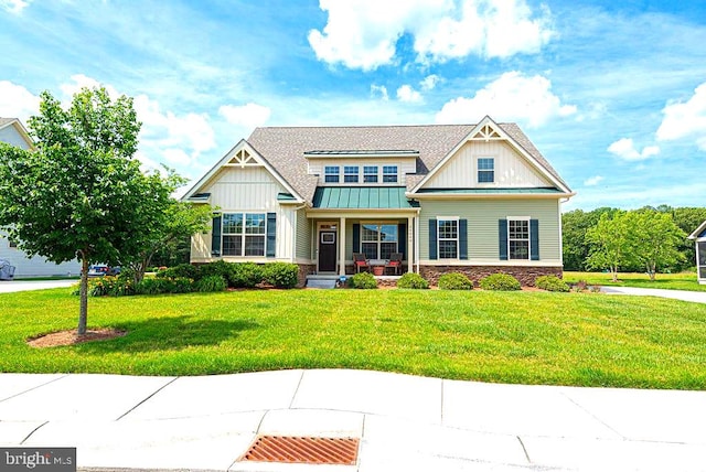 24440 Harvest Cir, Milton, DE 19968 - craftsman inspired home featuring board and batten siding, a front yard, a standing seam roof, and roof with shingles