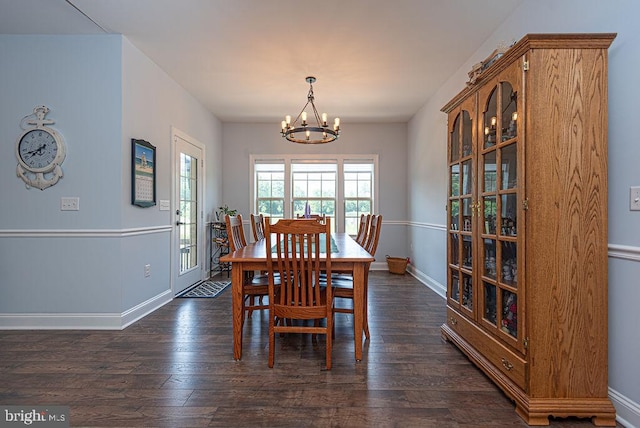 24440 Harvest Cir, Milton, DE 19968 - dining room featuring a chandelier, dark wood-type flooring, and baseboards