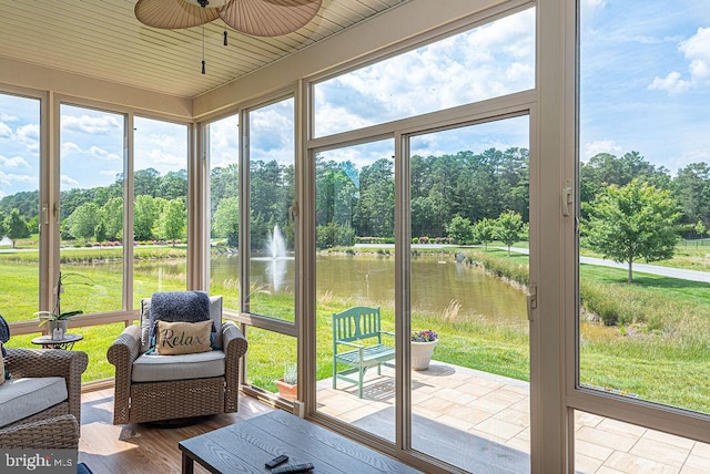 24440 Harvest Cir, Milton, DE 19968 - sunroom / solarium with a water view, ceiling fan, and view of wooded area