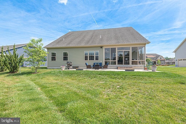 24440 Harvest Cir, Milton, DE 19968 - rear view of house featuring a patio area, a lawn, and a sunroom
