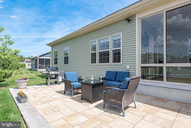 24440 Harvest Cir, Milton, DE 19968 - view of patio featuring area for grilling, an outdoor living space, and a sunroom