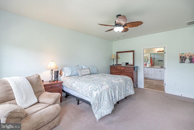24440 Harvest Cir, Milton, DE 19968 - bedroom with light colored carpet, connected bathroom, baseboards, and a ceiling fan