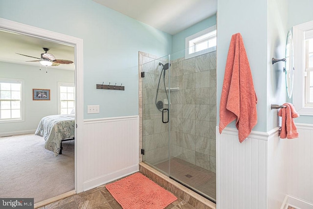 24440 Harvest Cir, Milton, DE 19968 - full bathroom featuring a wainscoted wall, connected bathroom, a stall shower, and ceiling fan