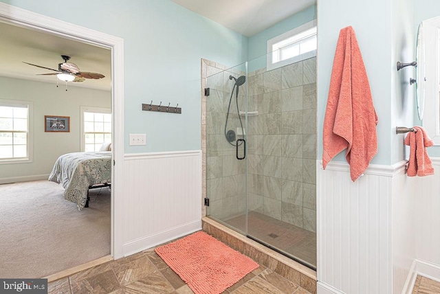 24440 Harvest Cir, Milton, DE 19968 - bathroom featuring ensuite bath, a wainscoted wall, a stall shower, and ceiling fan