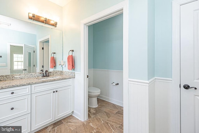 24440 Harvest Cir, Milton, DE 19968 - bathroom featuring a wainscoted wall, toilet, vanity, and marble finish flooring