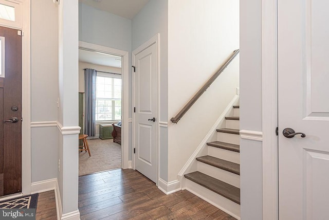 24440 Harvest Cir, Milton, DE 19968 - stairway featuring wood finished floors and baseboards