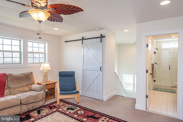 24440 Harvest Cir, Milton, DE 19968 - living room with a barn door, plenty of natural light, ceiling fan, carpet, and recessed lighting
