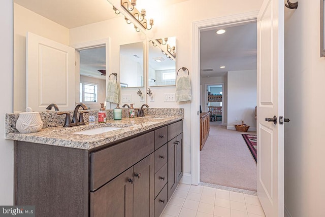 24440 Harvest Cir, Milton, DE 19968 - bathroom featuring double vanity, tile patterned floors, baseboards, and recessed lighting