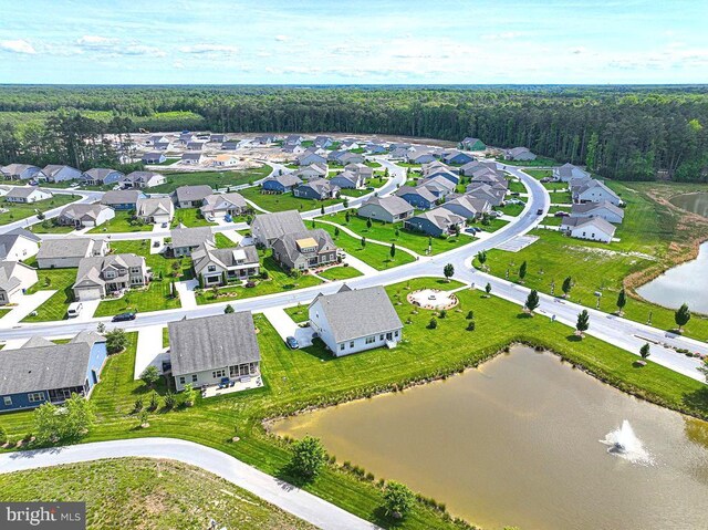 24440 Harvest Cir, Milton, DE 19968 - aerial view of residential area with a nearby body of water and a heavily wooded area
