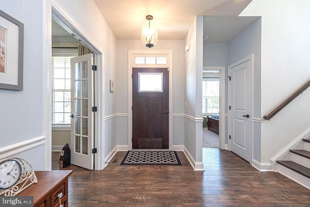 24440 Harvest Cir, Milton, DE 19968 - foyer entrance featuring stairs, dark wood-style floors, and baseboards