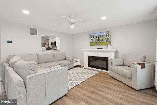 3146 Tipton Way, Abingdon, MD 21009 - living area with ceiling fan, light wood-style floors, a glass covered fireplace, and recessed lighting