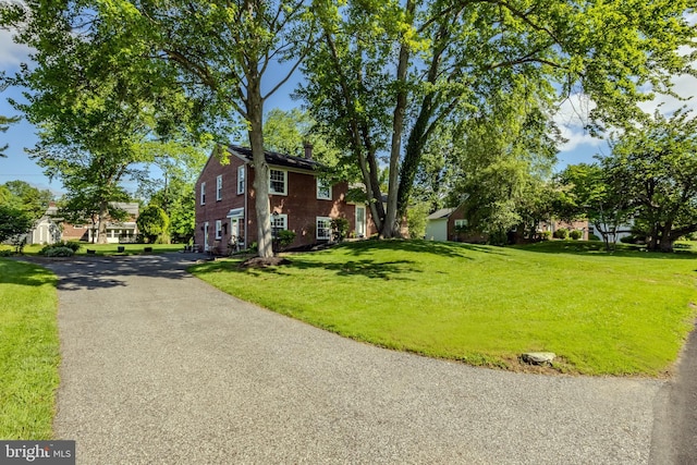 105 Lombardy Dr, Wallingford, PA 19086 - view of side of property featuring a lawn and driveway