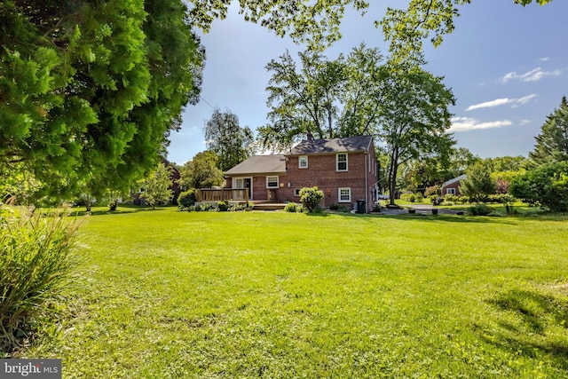 105 Lombardy Dr, Wallingford, PA 19086 - view of grassy yard with a wooden deck