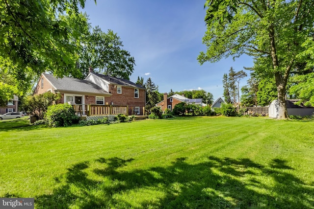 105 Lombardy Dr, Wallingford, PA 19086 - view of green lawn with a deck