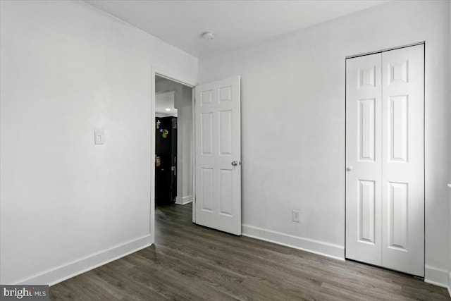 1209 Chapel Oaks Dr, Capitol Heights, MD 20743 - unfurnished bedroom with dark wood finished floors, baseboards, and a closet