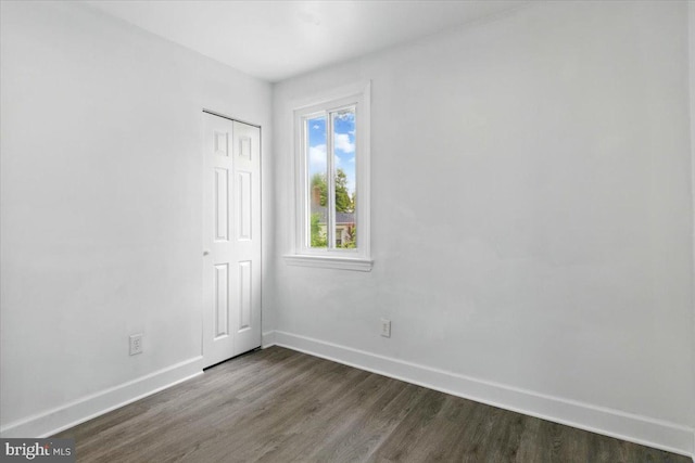 1209 Chapel Oaks Dr, Capitol Heights, MD 20743 - empty room with dark wood finished floors and baseboards