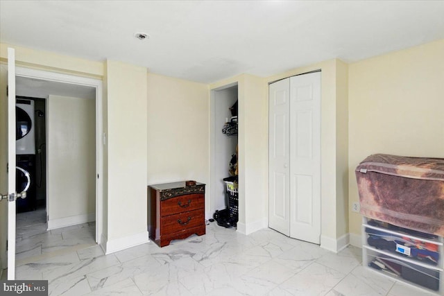 1209 Chapel Oaks Dr, Capitol Heights, MD 20743 - bedroom with marble look tiles, baseboards, and a closet