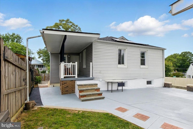 1209 Chapel Oaks Dr, Capitol Heights, MD 20743 - rear view of property with a fenced backyard and a patio
