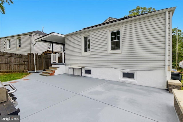 1209 Chapel Oaks Dr, Capitol Heights, MD 20743 - back of house featuring a patio area