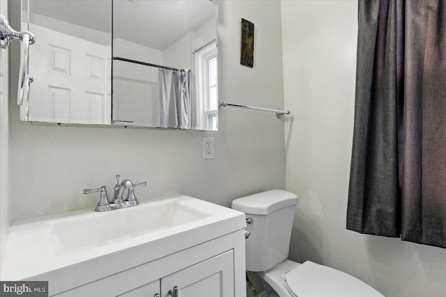 1209 Chapel Oaks Dr, Capitol Heights, MD 20743 - bathroom featuring toilet, vanity, and a shower with curtain