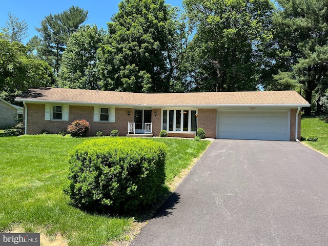 18 Bittersweet Dr, Hagerstown, MD 21740 - ranch-style house with driveway, an attached garage, and a front lawn