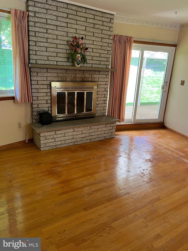 18 Bittersweet Dr, Hagerstown, MD 21740 - unfurnished living room with a fireplace, baseboards, and plenty of natural light