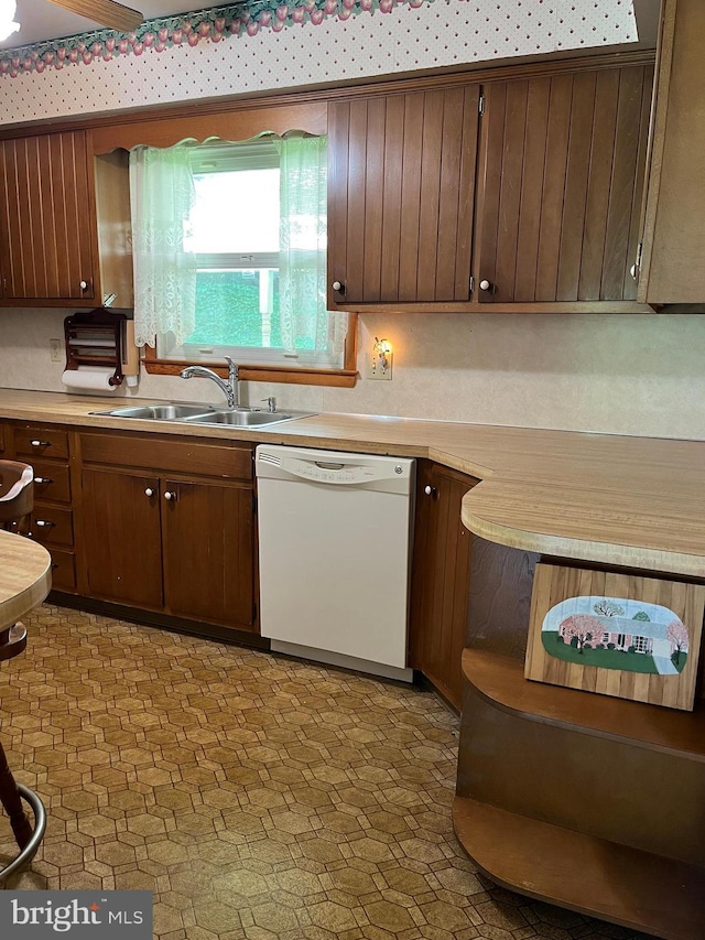 18 Bittersweet Dr, Hagerstown, MD 21740 - kitchen with white dishwasher, a sink, and light countertops