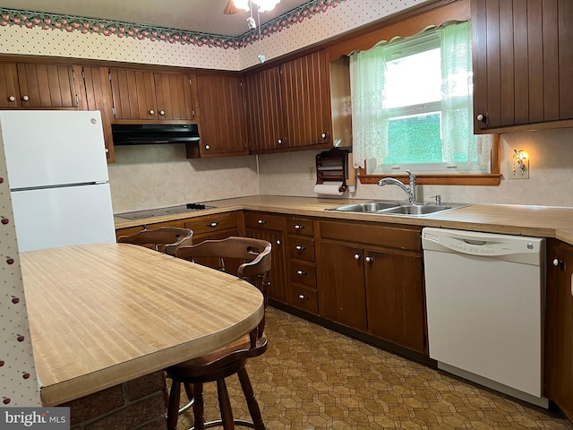 18 Bittersweet Dr, Hagerstown, MD 21740 - kitchen featuring white appliances, under cabinet range hood, a sink, light countertops, and tasteful backsplash