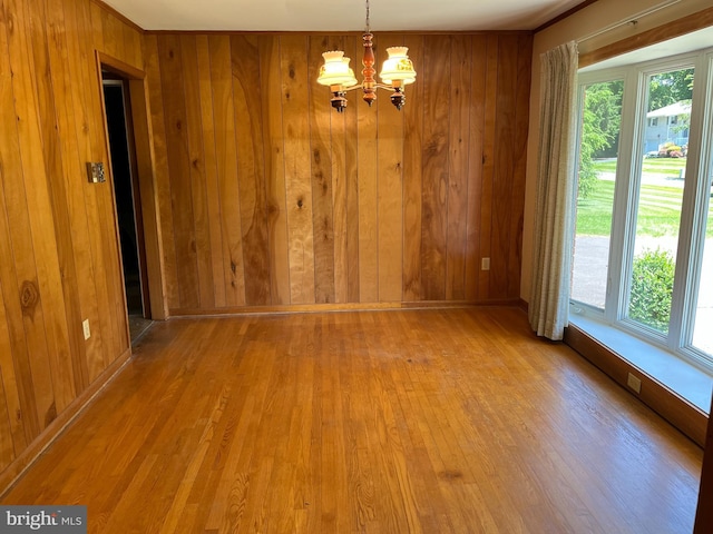 18 Bittersweet Dr, Hagerstown, MD 21740 - unfurnished dining area featuring wood walls, wood finished floors, a chandelier, and baseboards