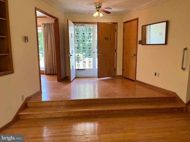 18 Bittersweet Dr, Hagerstown, MD 21740 - foyer with wood finished floors, ceiling fan, stairway, and baseboards