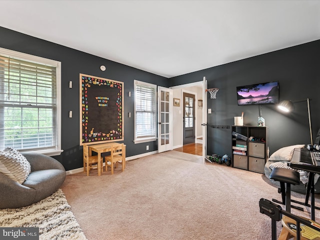1549 N Jefferson Ct, Lancaster, PA 17602 - carpeted living room featuring healthy amount of natural light and baseboards